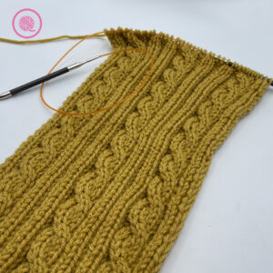 needle knit rope cable cowl in progress